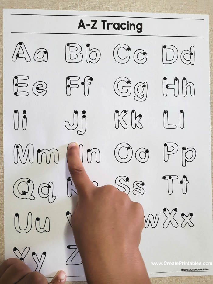 use a finger to trace the letters
